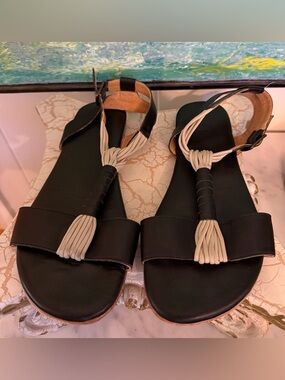 Fiel Brand Black Flat Sandals with Cream Braided Tassels